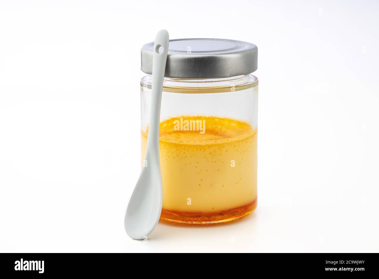 Cream caramel in a jar isolated on white background Stock Photo - Alamy