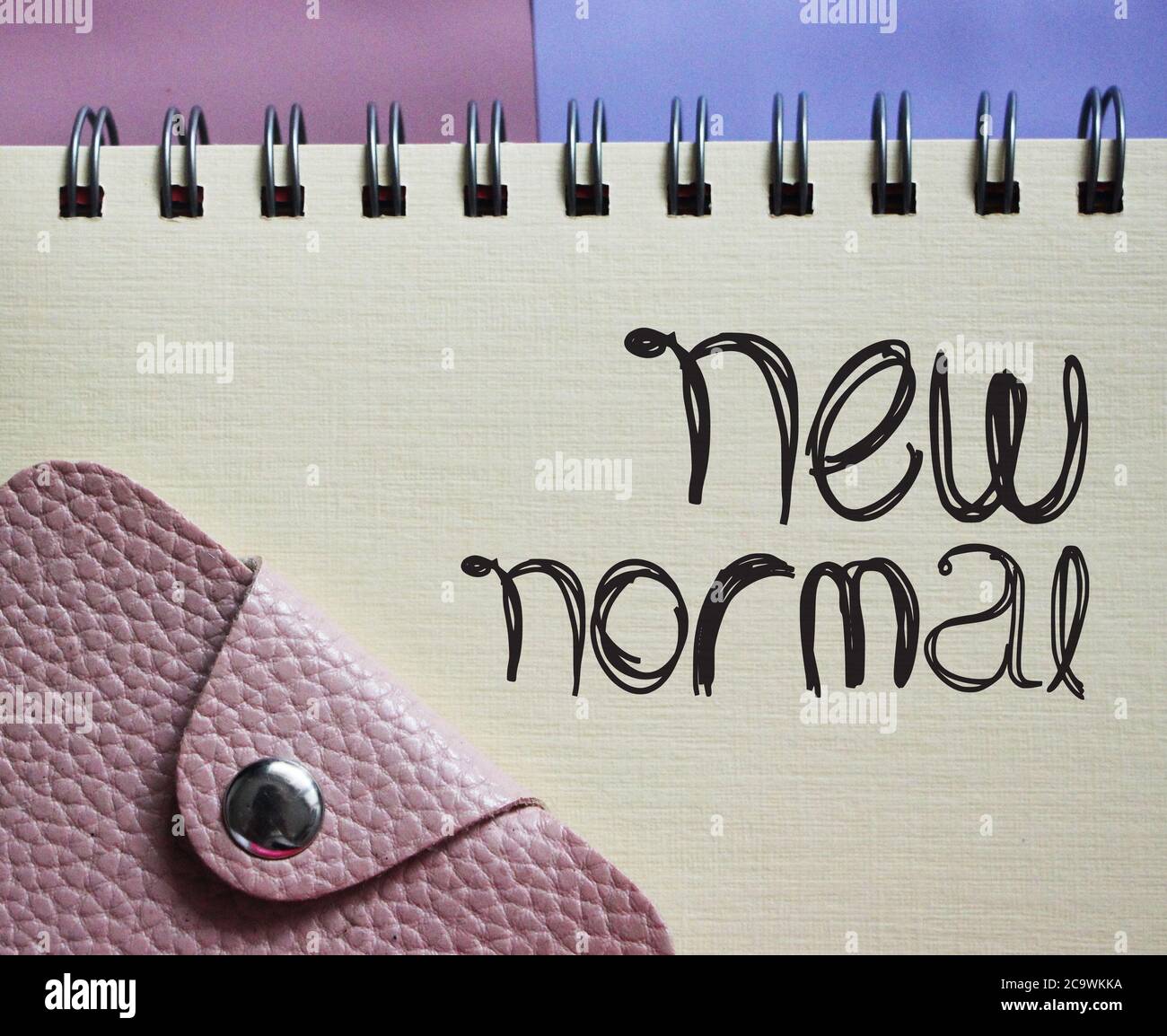 New normal words in copybook and wallet. Word after Coronavirus. social and business Concept. Stock Photo