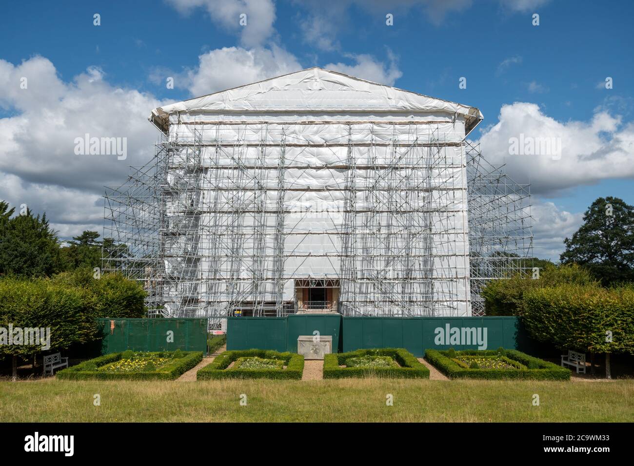 Clandon Park House, which had a major fire in 2015, covered in plastic and scaffolding, Surrey