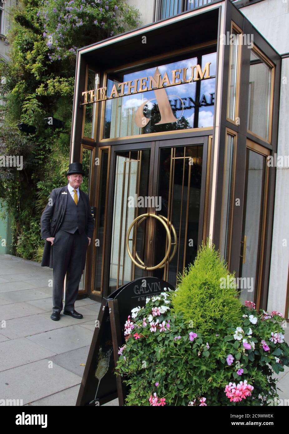 London, UK. 1st Aug, 2020. A doorman of the Athenaeum hotel stands at the entrance.Many of London's 5 star Luxury Hotels which are world renowned are still closed, despite the government's loosening of the hospitality sector's restrictions. With travel from the USA still minimal and weddings, society gatherings and corporate events at hugely reduced levels, these high end destinations are either closed or running on skeleton staffing. Credit: Keith Mayhew/SOPA Images/ZUMA Wire/Alamy Live News Stock Photo