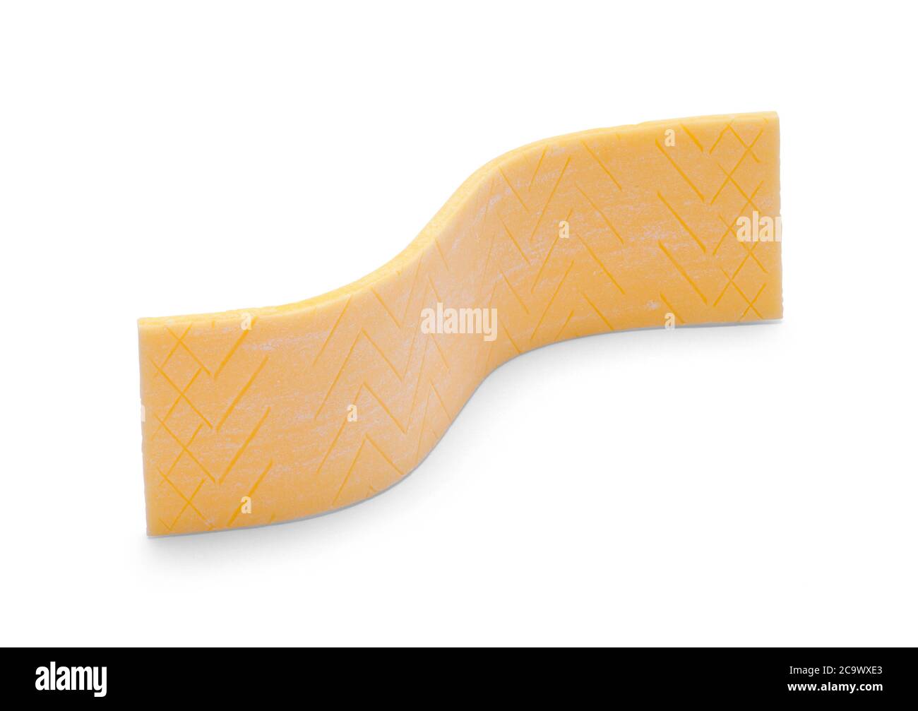Stick of Wavy Yellow Gum Isolated on White. Stock Photo