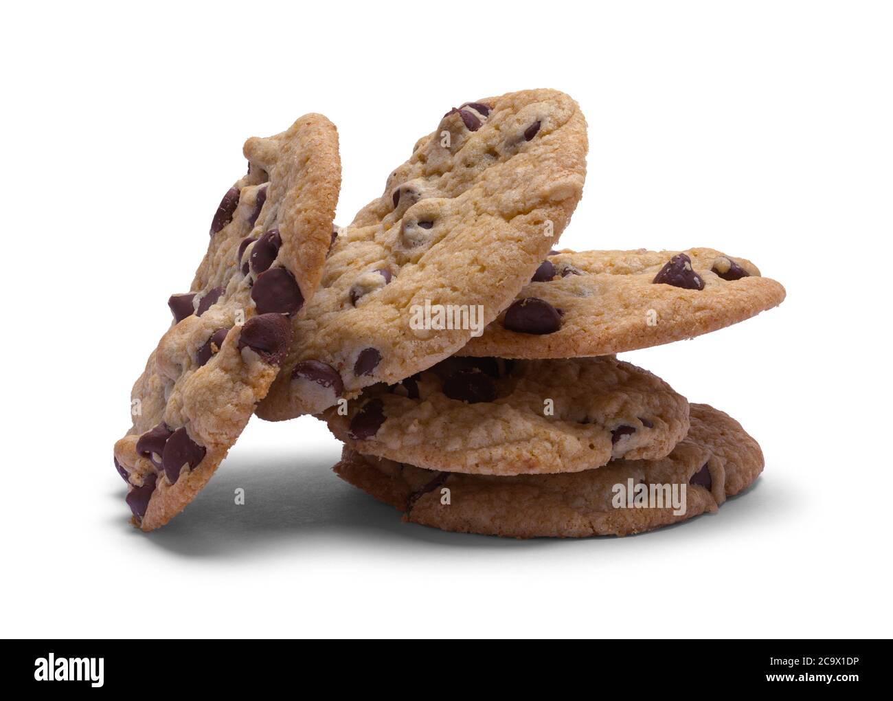 Tipped Pile of Chocolate Chip Cookies Isolated on White. Stock Photo