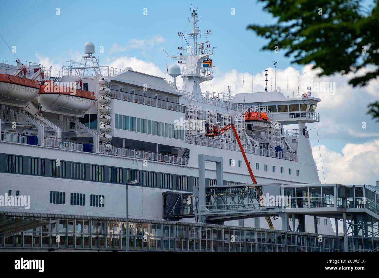 Helsinki / Finland - July 31, 2020: Closeup of a large passenger roro-ferry moored to passenger terminal. Stock Photo