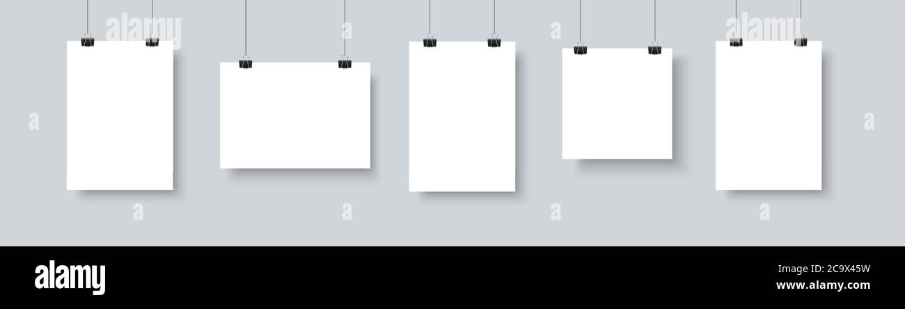 Paper paper poster mockup on grey gallery wall. Empty A4 sized vector paper frame mockup hanging with paper clip Stock Vector