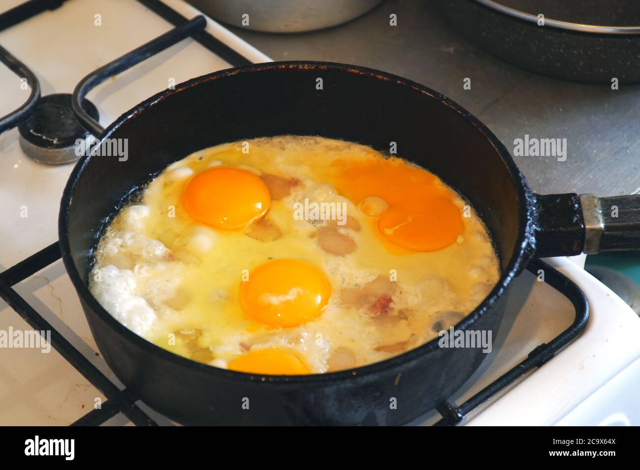 Eggs are fried in a pan. Cooking fried egg Stock Photo