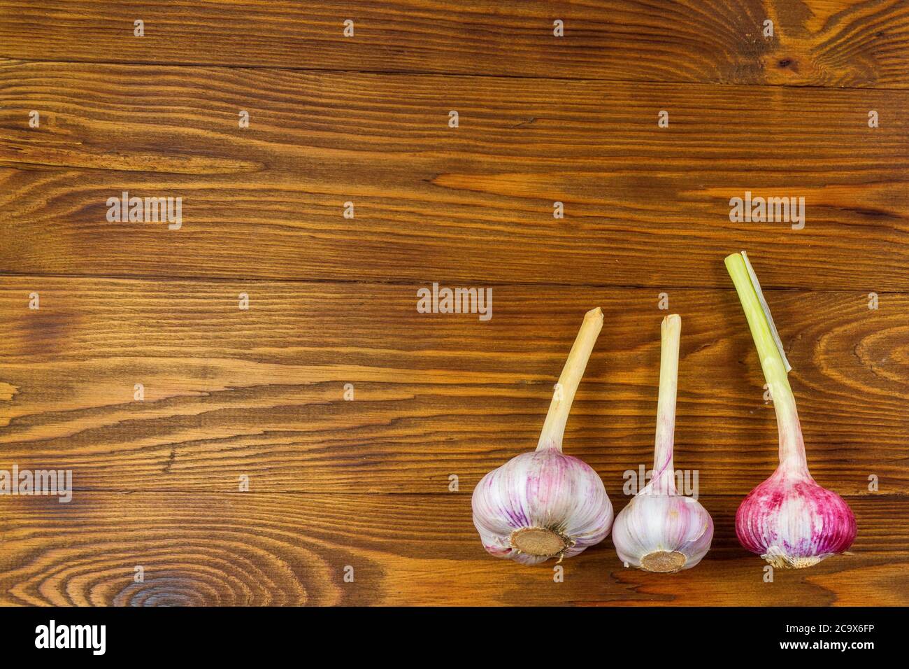 High Angle Still Life View of garlic on Rustic Wood Table Stock Photo ...