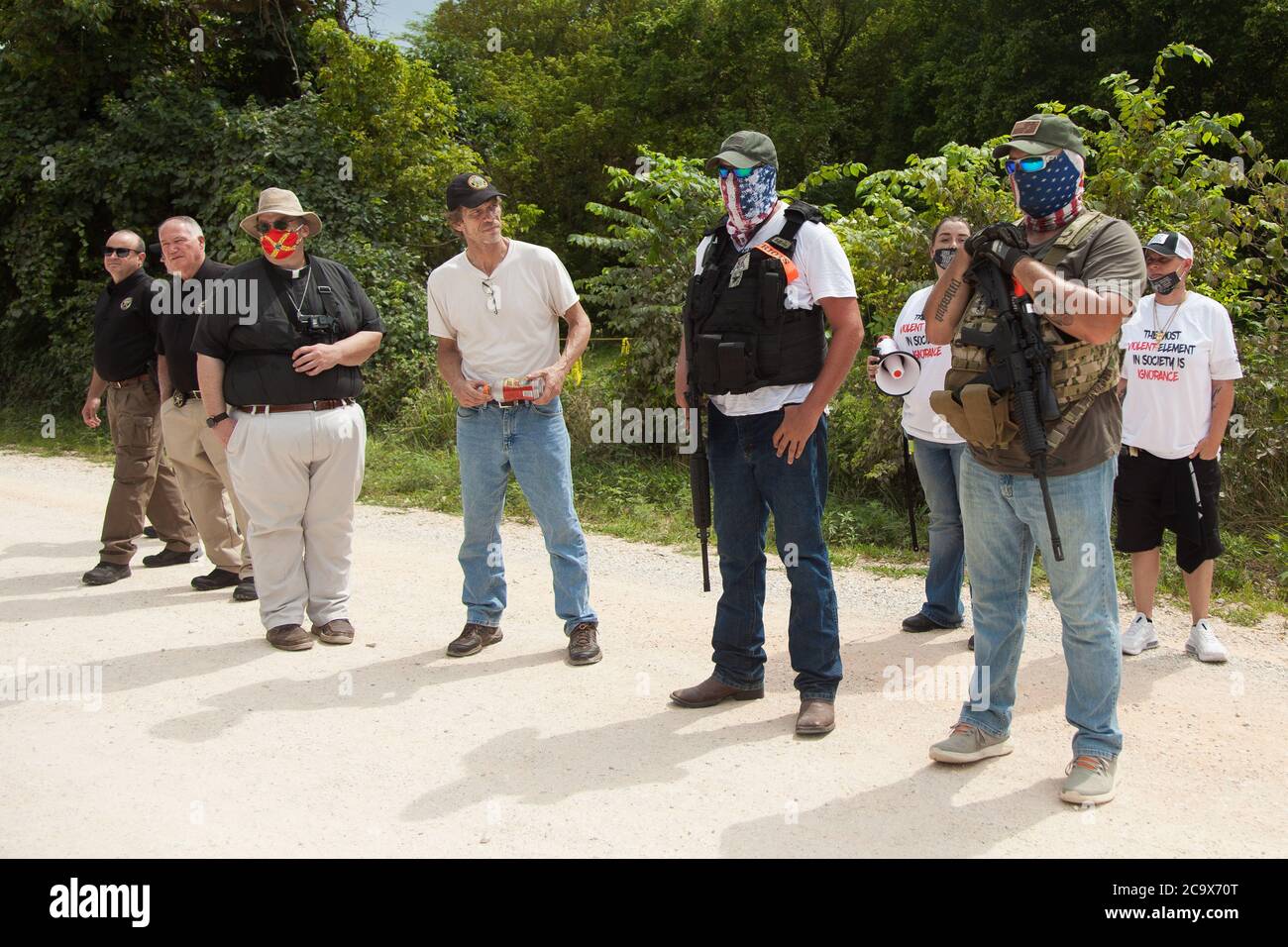 Zinc, Arkansas, USA. 2nd Aug, 2020. Aug. 2, 2020 Armed residents stand