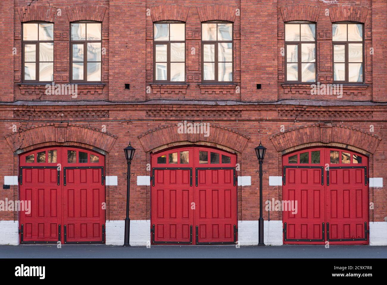Fire station, an old historic brick building (1880s) with red gates