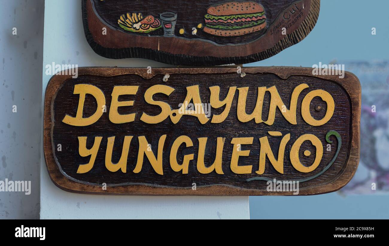 A restaurant sign with the text 'Desayuno yungueño' (breakfast from the Yungas) in a market of Coroico, Bolivia. Stock Photo