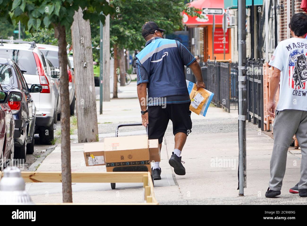 NEW YORK, NY AUGUST 2 An Amazon Prime employee delivers packages on