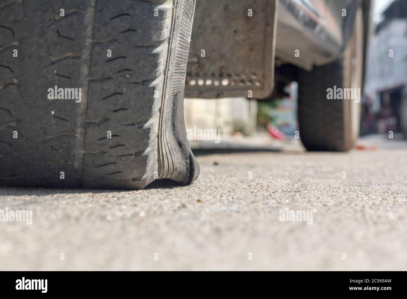 burst car tire on street Stock Photo Alamy