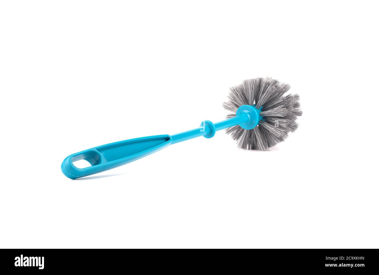 Plastic blue toilet brush with a handle to the camera. Toilet brush isolated on white background. Close up. Copy space. Stock Photo
