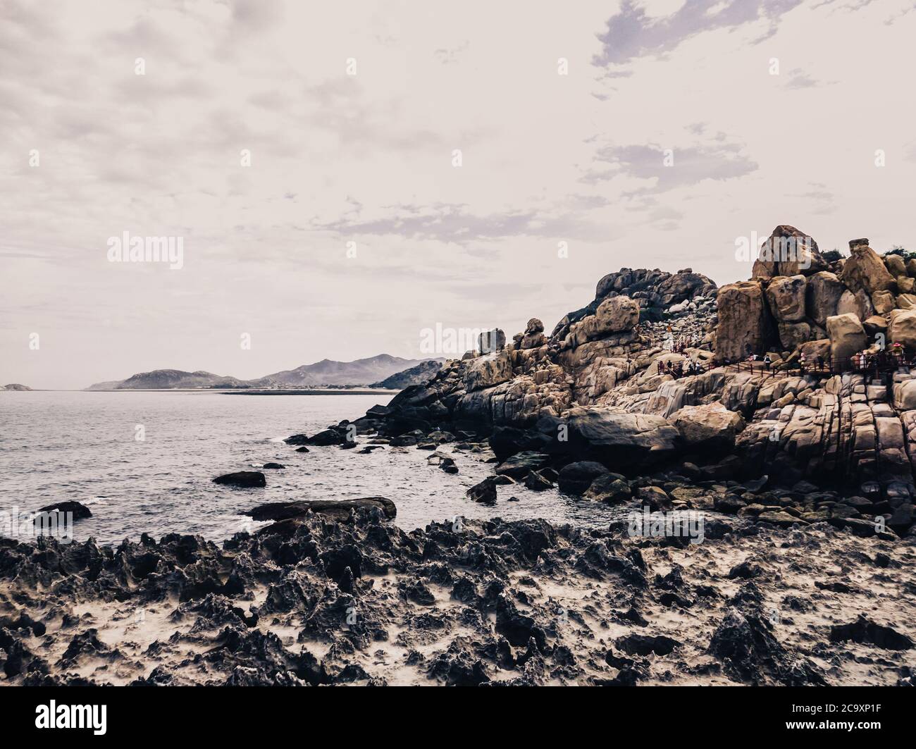 Huge strange stone and sea. Alien planet landscape, rock formations ...