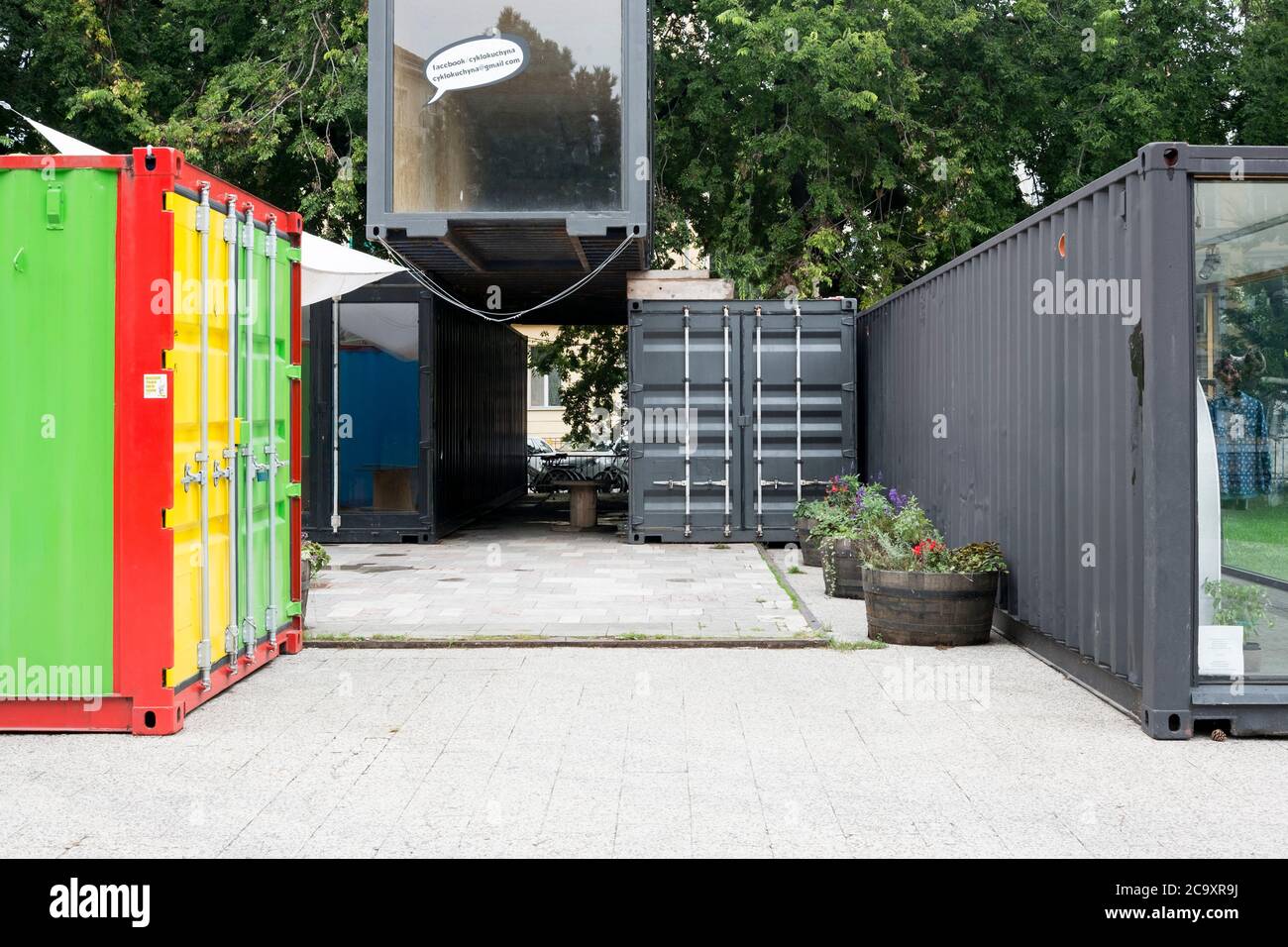 Old shipping containers are reused, reporposed, brightly painted for