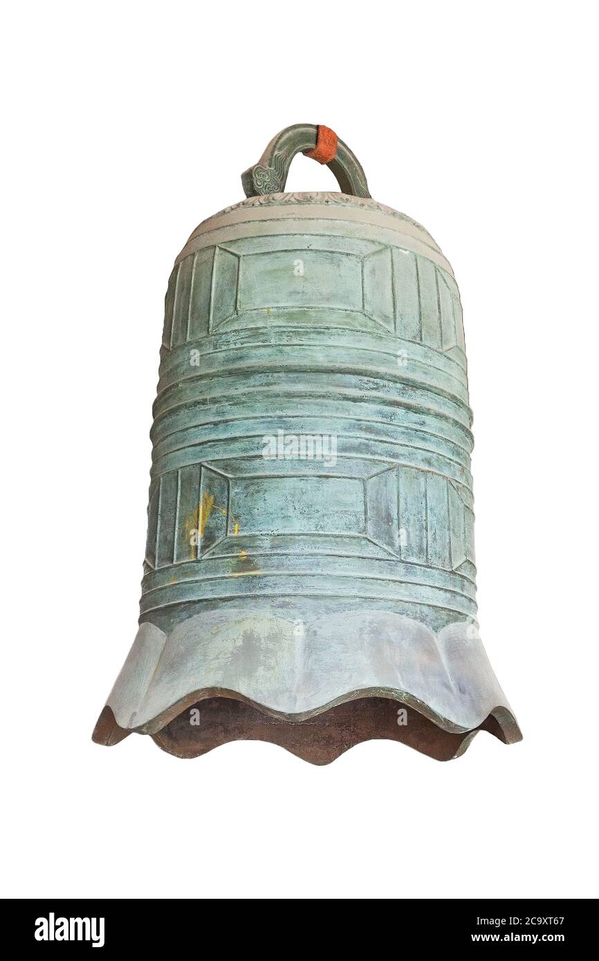 Chinese old style big bronze bell isolated on white. The bronze bell is one of the oldest musical instruments in asia. Stock Photo