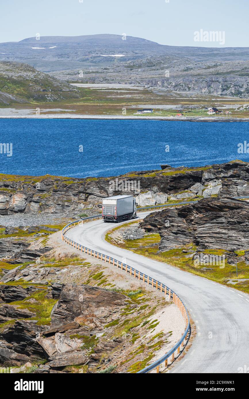 A cargo truck on the county road 889 in northern Norway in summer. Stock Photo
