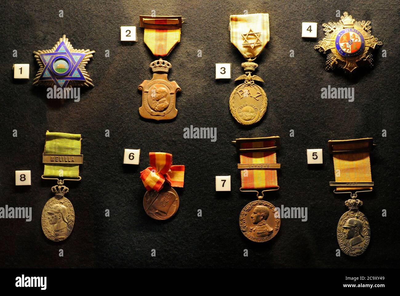 Spanish military decorations: 1. Plate of the Commander in the Mehdavian Order. August 18, 1926. Belonging to Admiral Alejandro Molins; 2. Medal of homage of the City Councils to the Kings (May 17, 1925); 3. Moroccan Peace Medal (November 21, 1927), belonging to Admiral Alejandro Molins; 4. Cross of War (March 29, 1938), belonging to Admiral Alejandro Molins; 5. Medal of the Melilla campaign (March 20, 1910). September 8, 1910. Belonging to Admiral Benitez Inglott; 6. Catalonia Cruiser Medal, 1908; 7. Medal of Africa (September 8, 1912) and 8. Military medal of Morocco (June 29, 1916), belongi Stock Photo