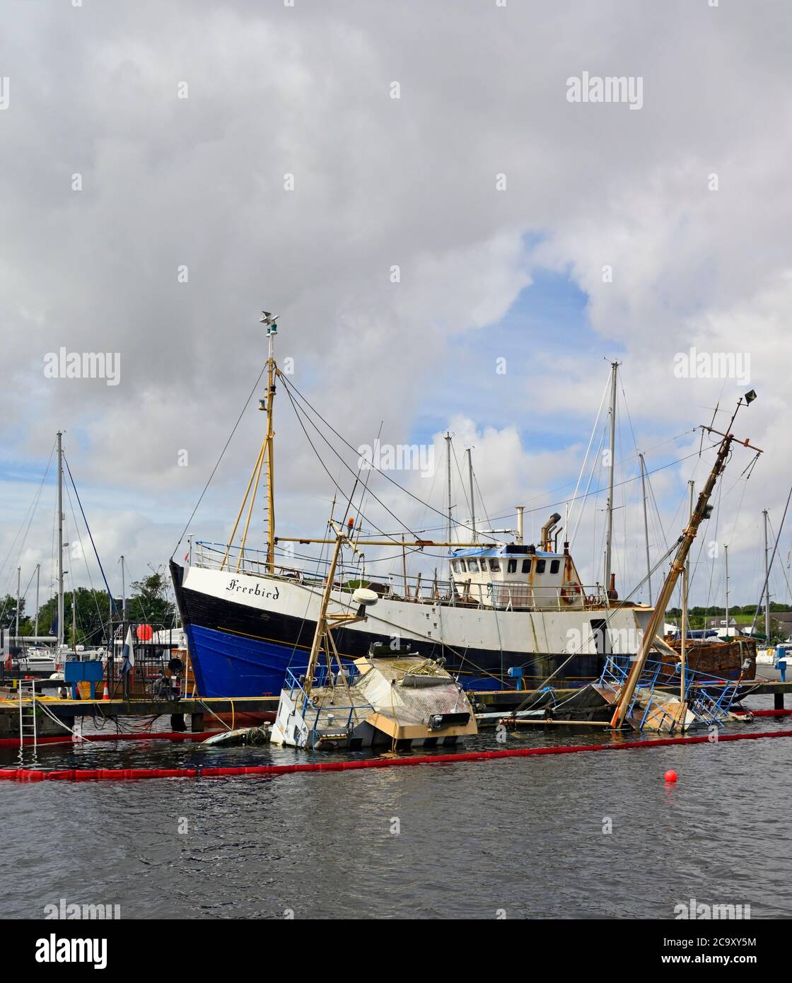 Capsized trawler. Glasson Dock, Lancashire, England, United Kingdom, Europe. Stock Photo