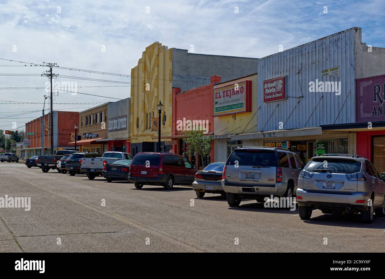 Parked Cars, Trucks and SUVÕs in front of Shops and Stores, painted in