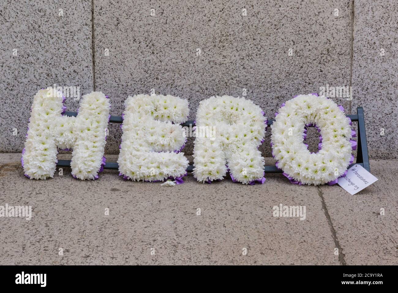 Hero flower display by the 'Save our Statues' campaign on a statue in London, England Stock Photo