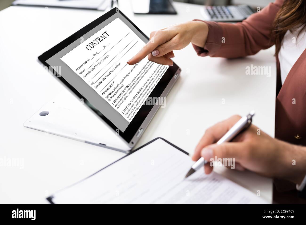 Legal Law Contract On Convertible Laptop Screen Stock Photo