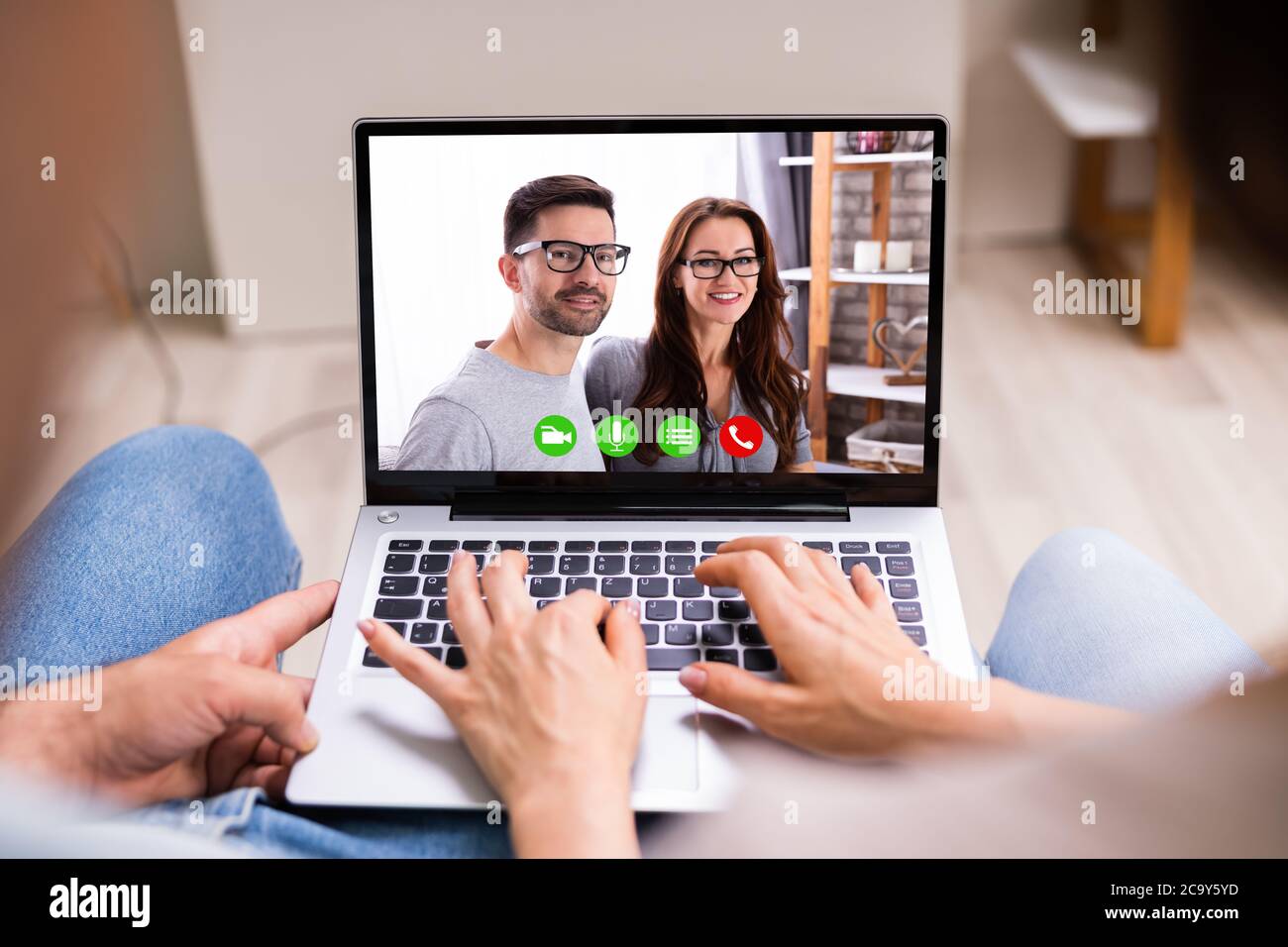 Couple In Video Conference Chat With Friends Stock Photo