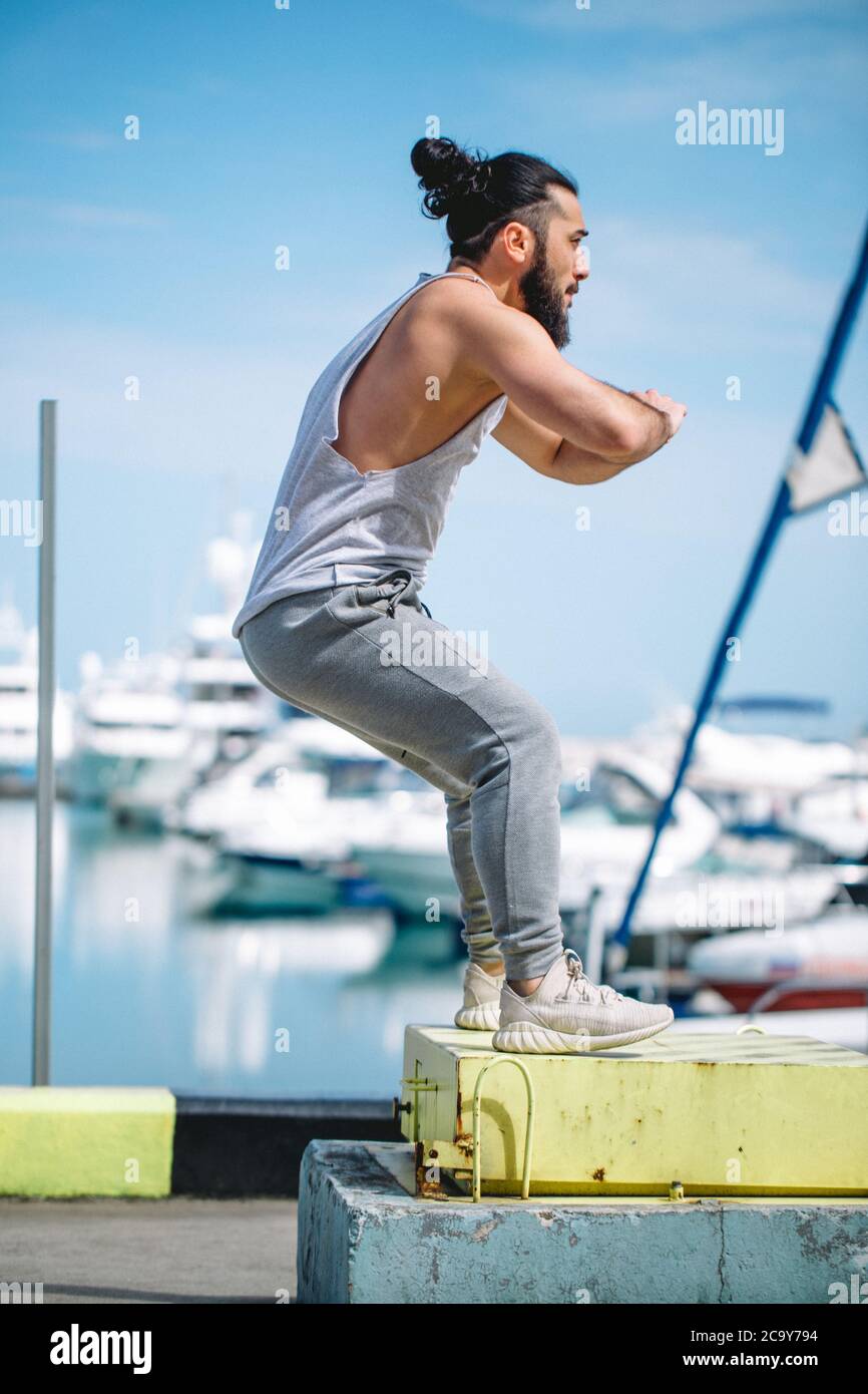 Sportsman fit male jumper doing explosive strength training jumps