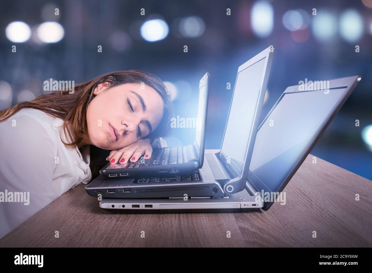 Businesswoman is tired due to too much work. Concept of stress and overwork Stock Photo