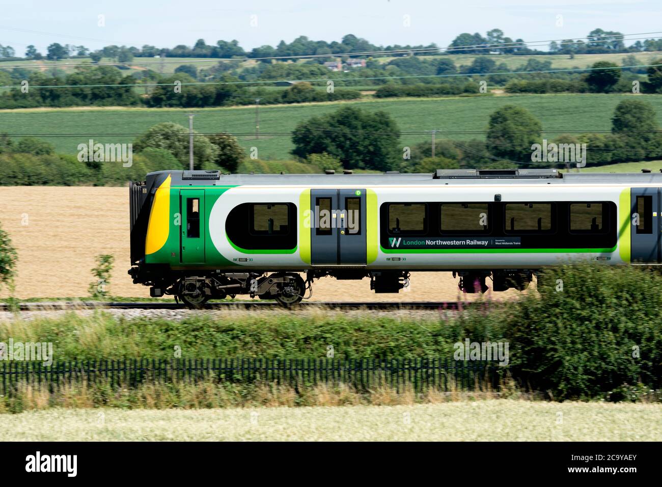London NorthWestern Railway class 350 electric train on the West Coast Main Line, Northamptonshire, England, UK Stock Photo