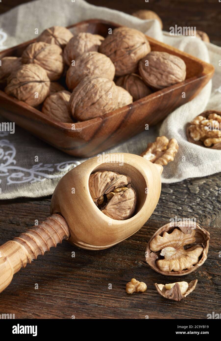 Nutcracker and walnuts  on wooden background Stock Photo