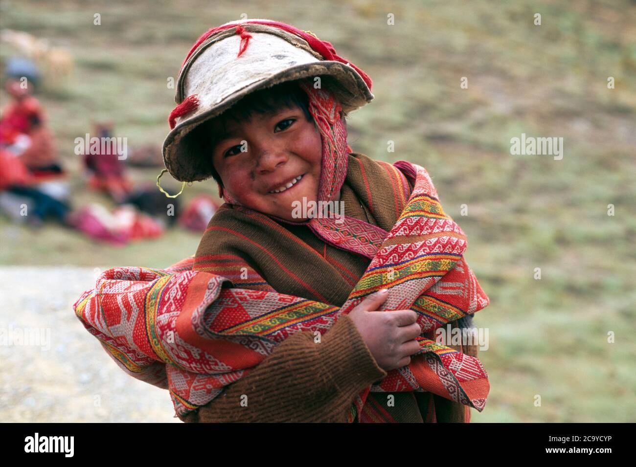 Peruvian boy smiling in traditional costume, Cusco, Peru, South America Stock Photo