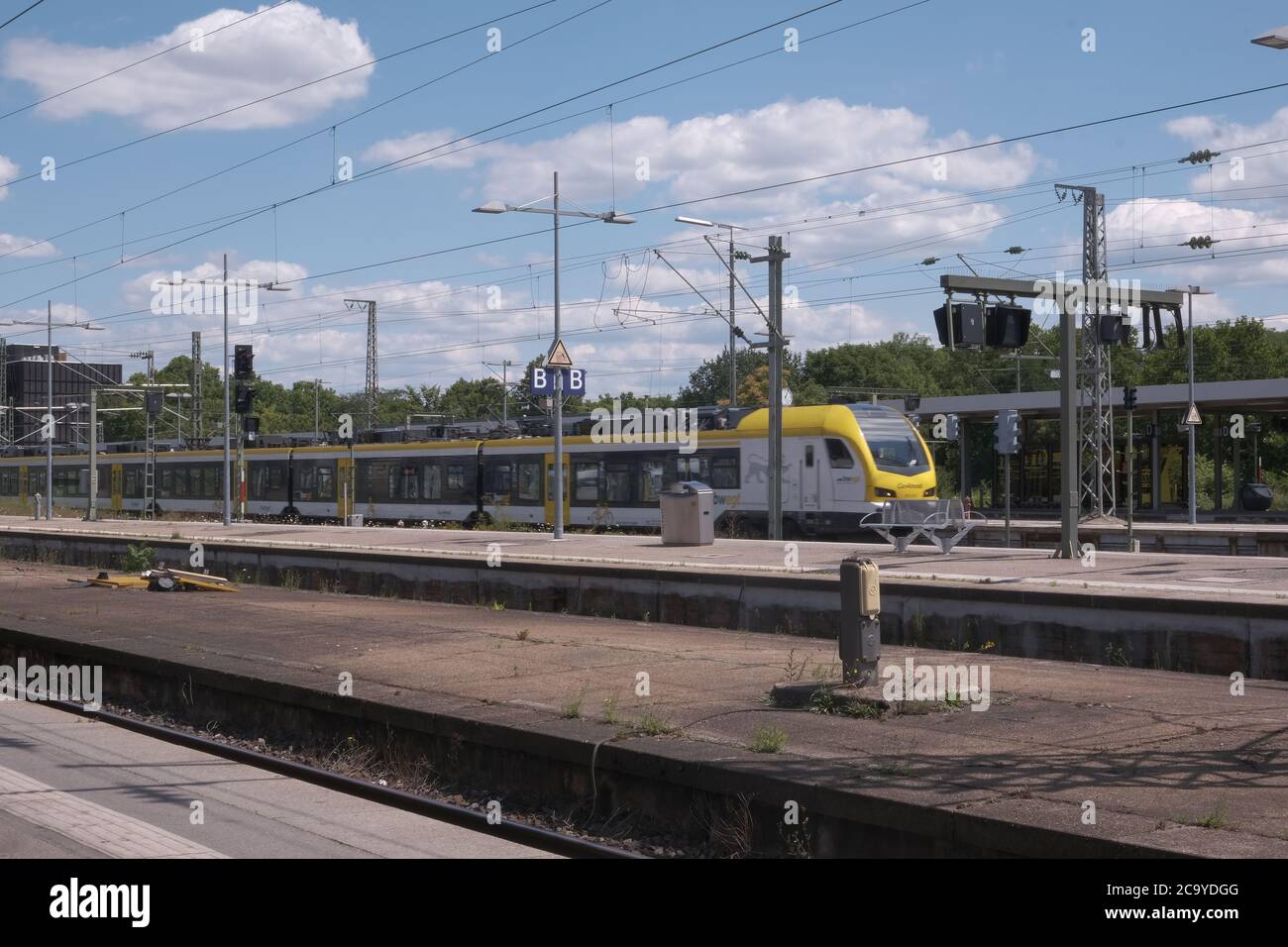 White and Yellow Regio Train Entering Stuttgart Hbf Stock Photo