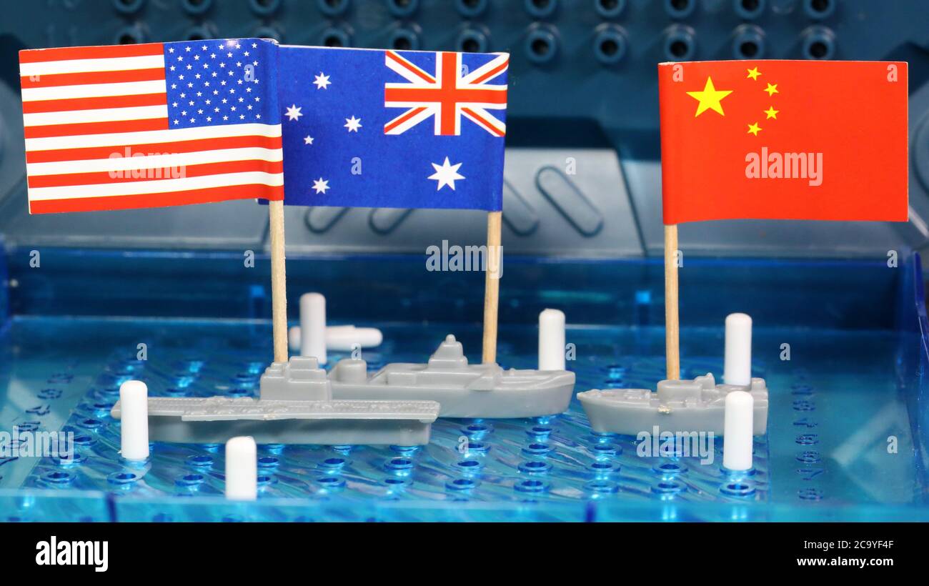 American US and Royal Australian Naval navy ships meet head on Chinese navy warship in disputed south china spratly island international waters Stock Photo