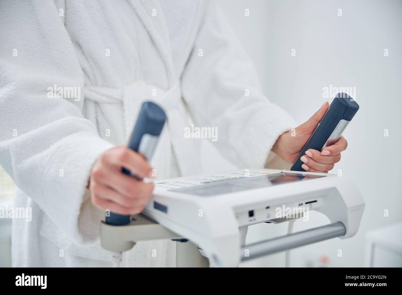 Woman is monitoring her individual progress after physical exercise ...