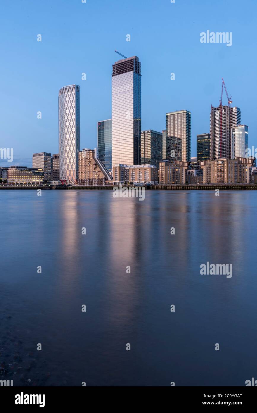 View across Thames from west at sunset. Isle of Dogs, London, United Kingdom. Architect: Various, 2020. Stock Photo