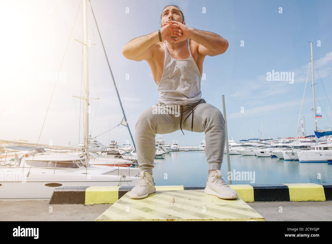 Extreme Jump Squats fitness training. Crossfit Athlete caucasian man