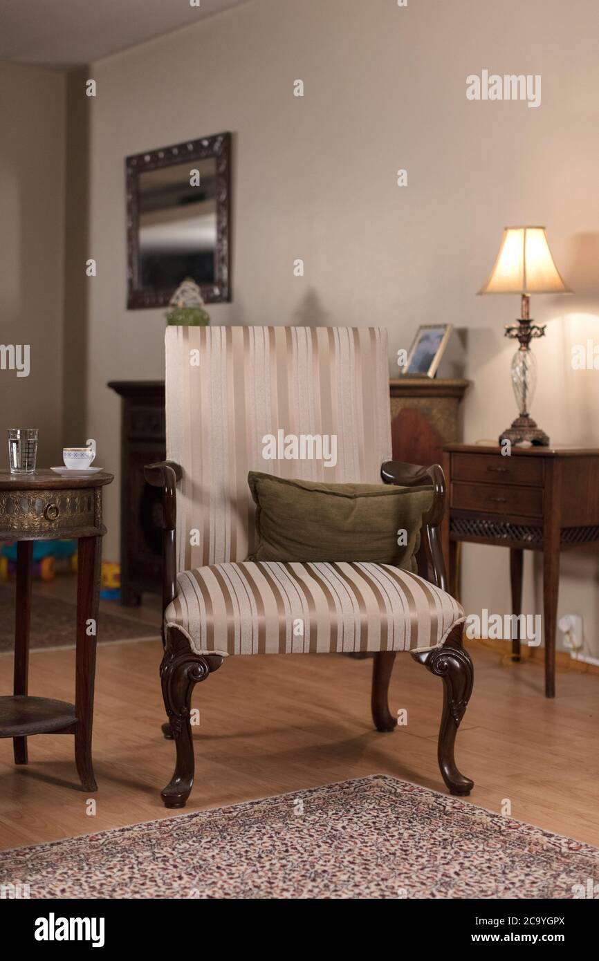 Vintage Single Armchair and Blur Room Background Stock Photo - Alamy