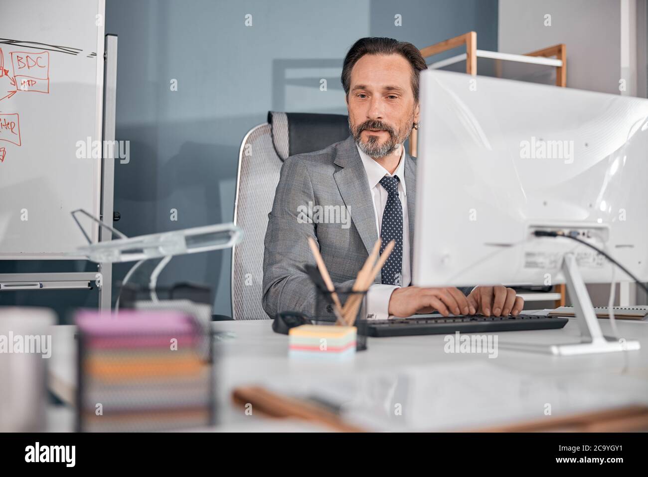 Male worker using modern computer in office Stock Photo