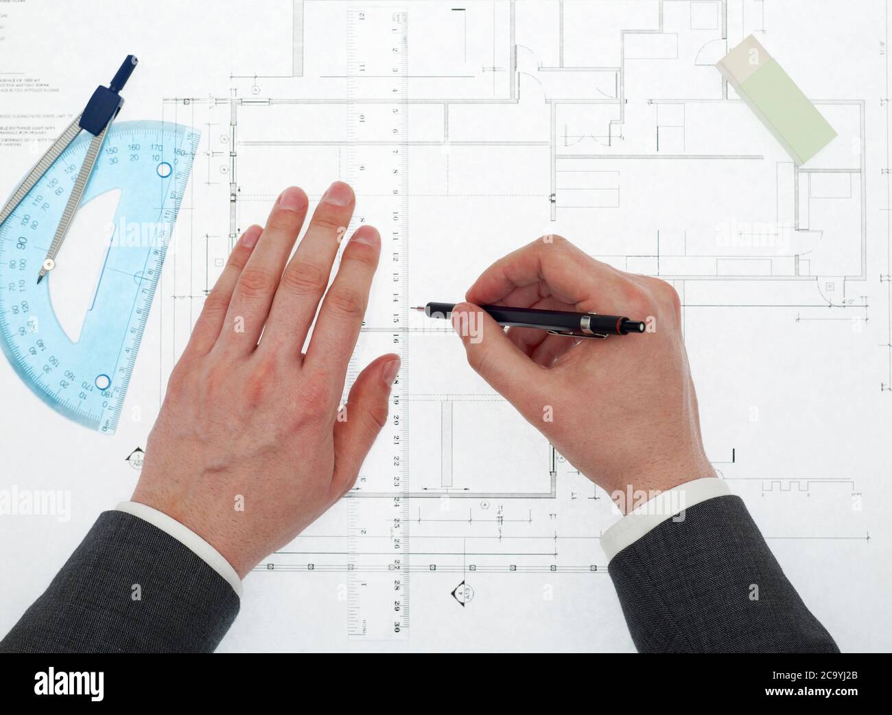 Architect working on blueprints Stock Photo