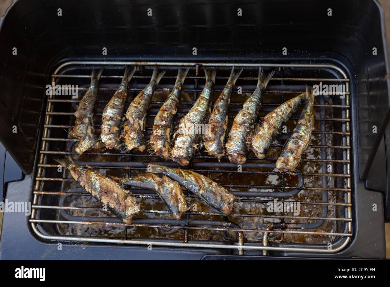 grilled sardines, fish on the electric grill, top view Stock Photo Alamy