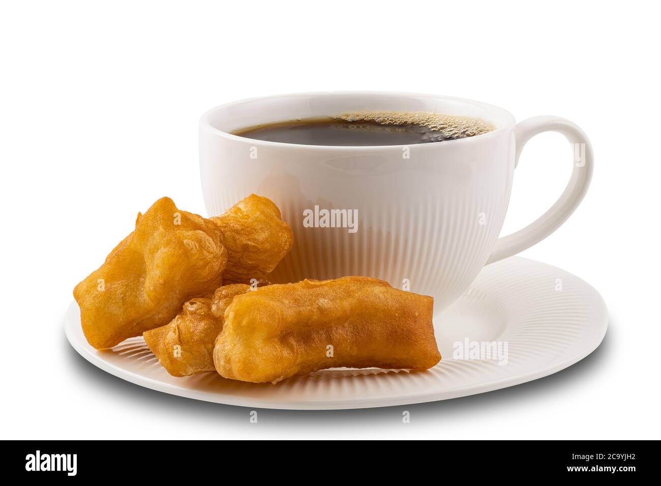 Deep-fried dough stick and a cup of hot black coffee in a white ceramic plate on white background with clipping path. Stock Photo