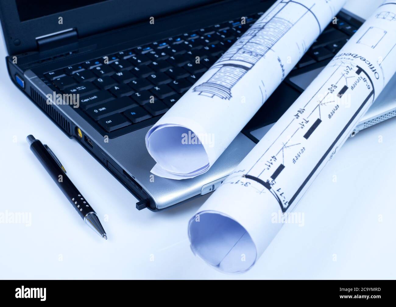 Blueprints, pen and laptop Stock Photo Alamy
