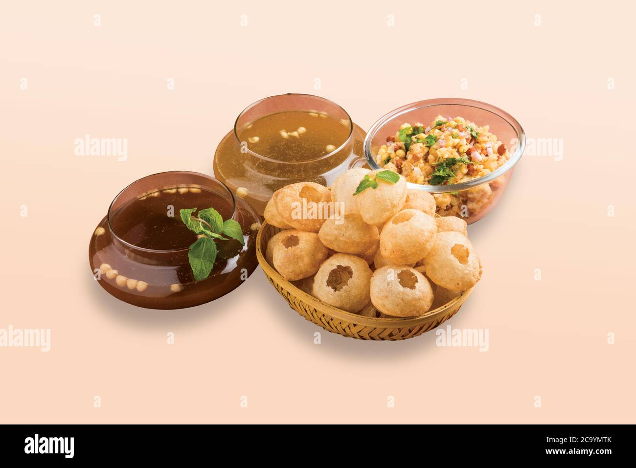 Panipuri or Golgappa is a common street snack from India. It's a round, hollow puri filled with a mixture of flavoured water and other chat items. Stock Photo