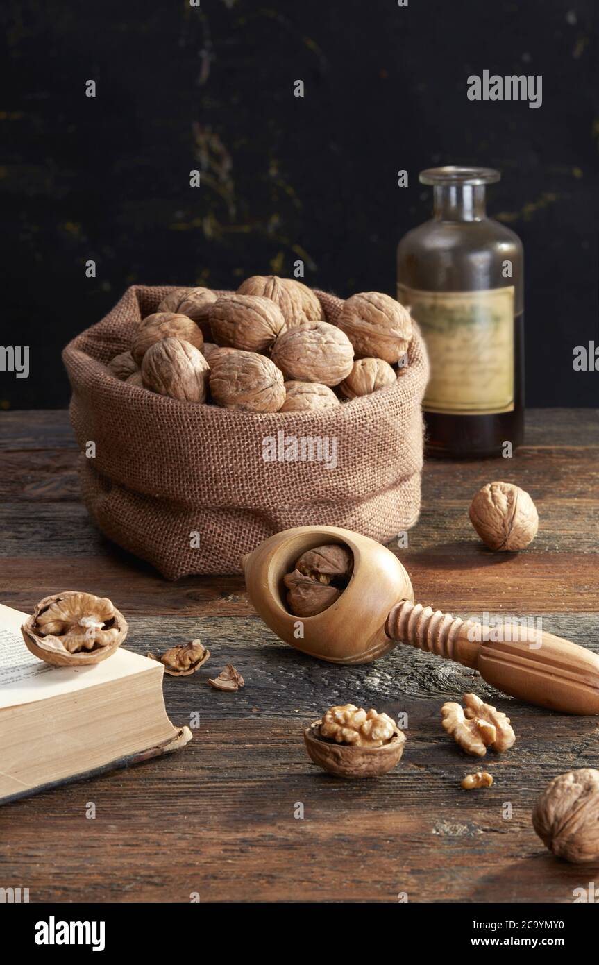 Walnuts and nutcracker  on wooden background Stock Photo