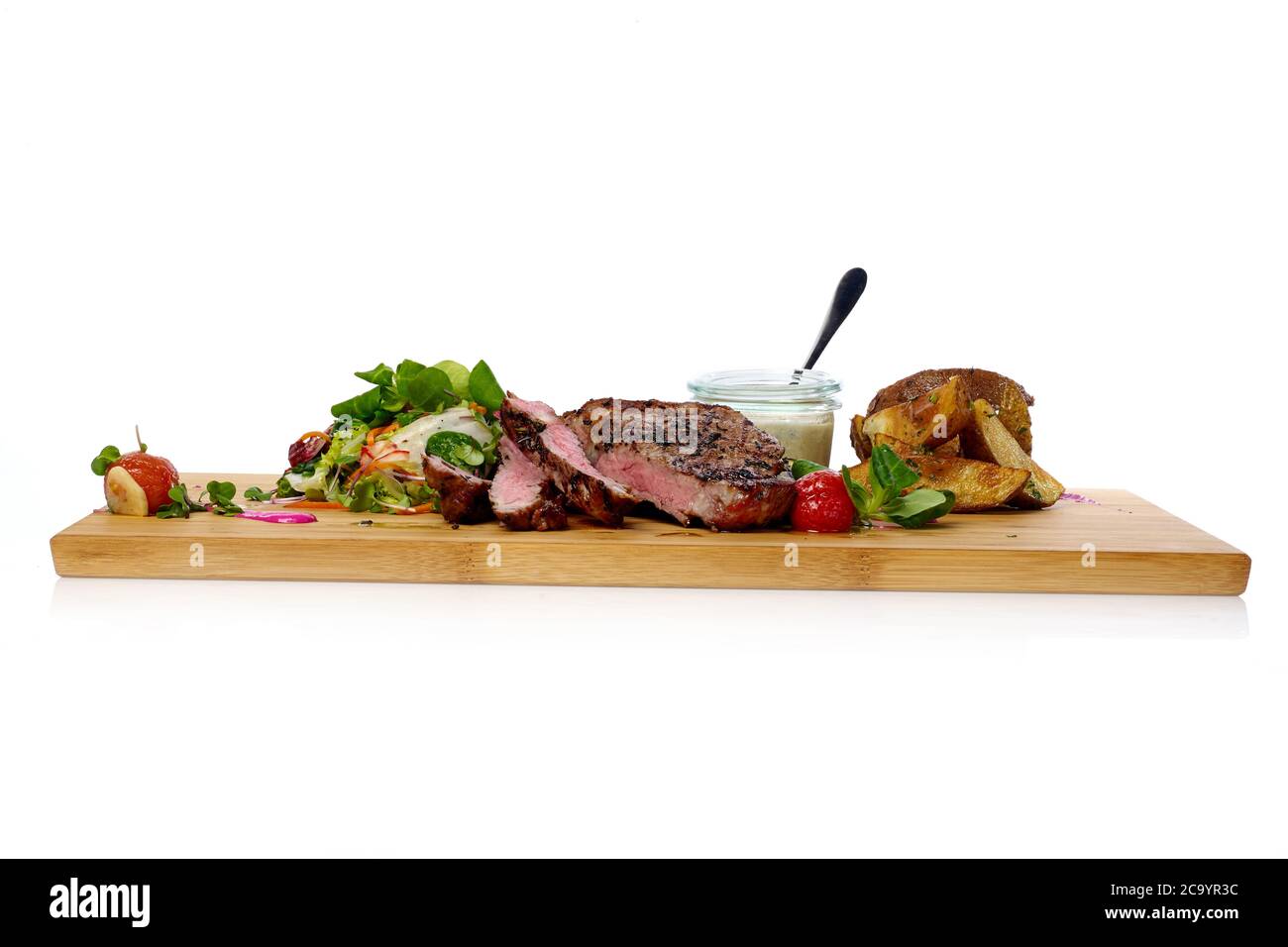 Grilled steak with potatoes and salad Stock Photo - Alamy