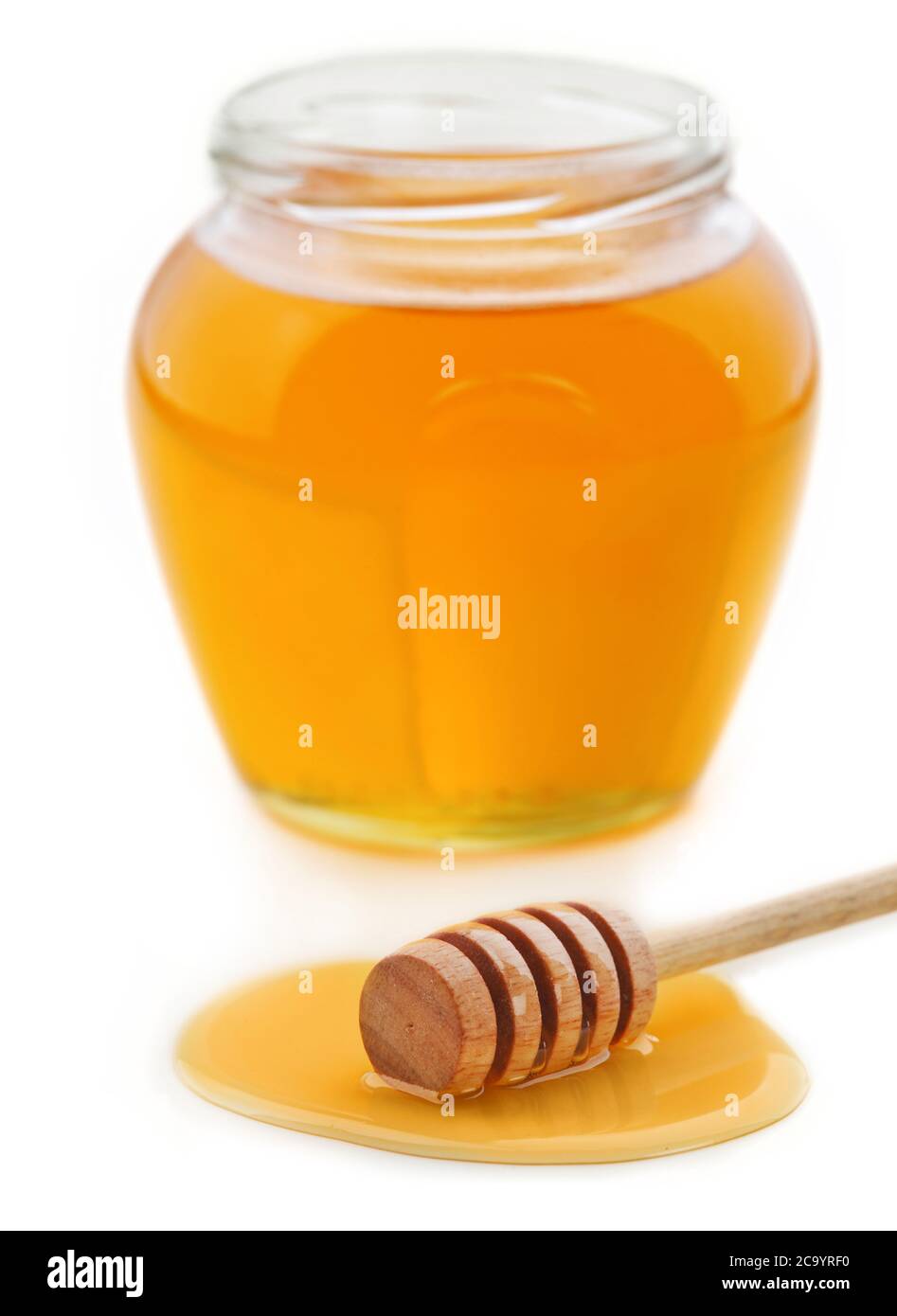 Honey dipper and jar isolated Stock Photo Alamy