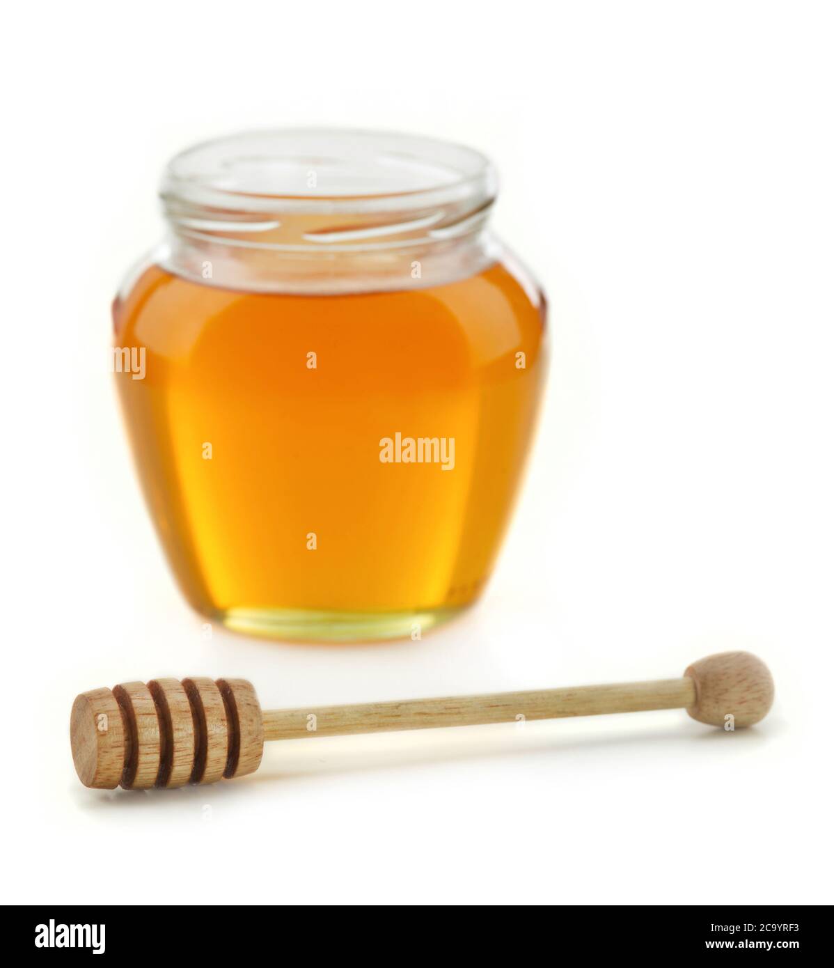 Honey pot and dipper isolated Stock Photo Alamy