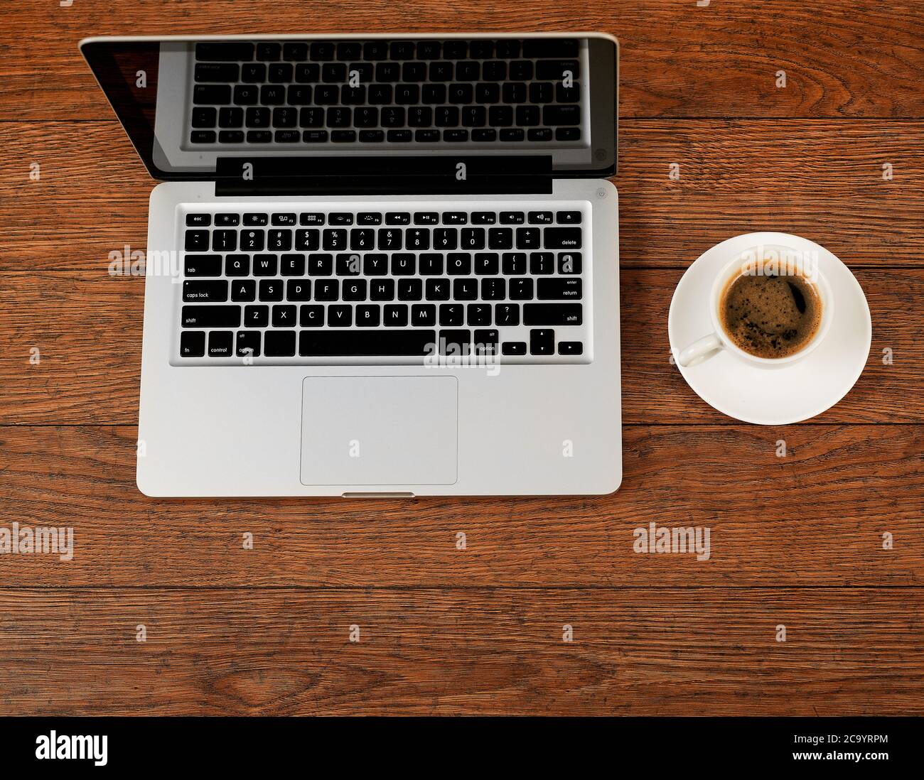 Laptop and coffee on desk Stock Photo - Alamy
