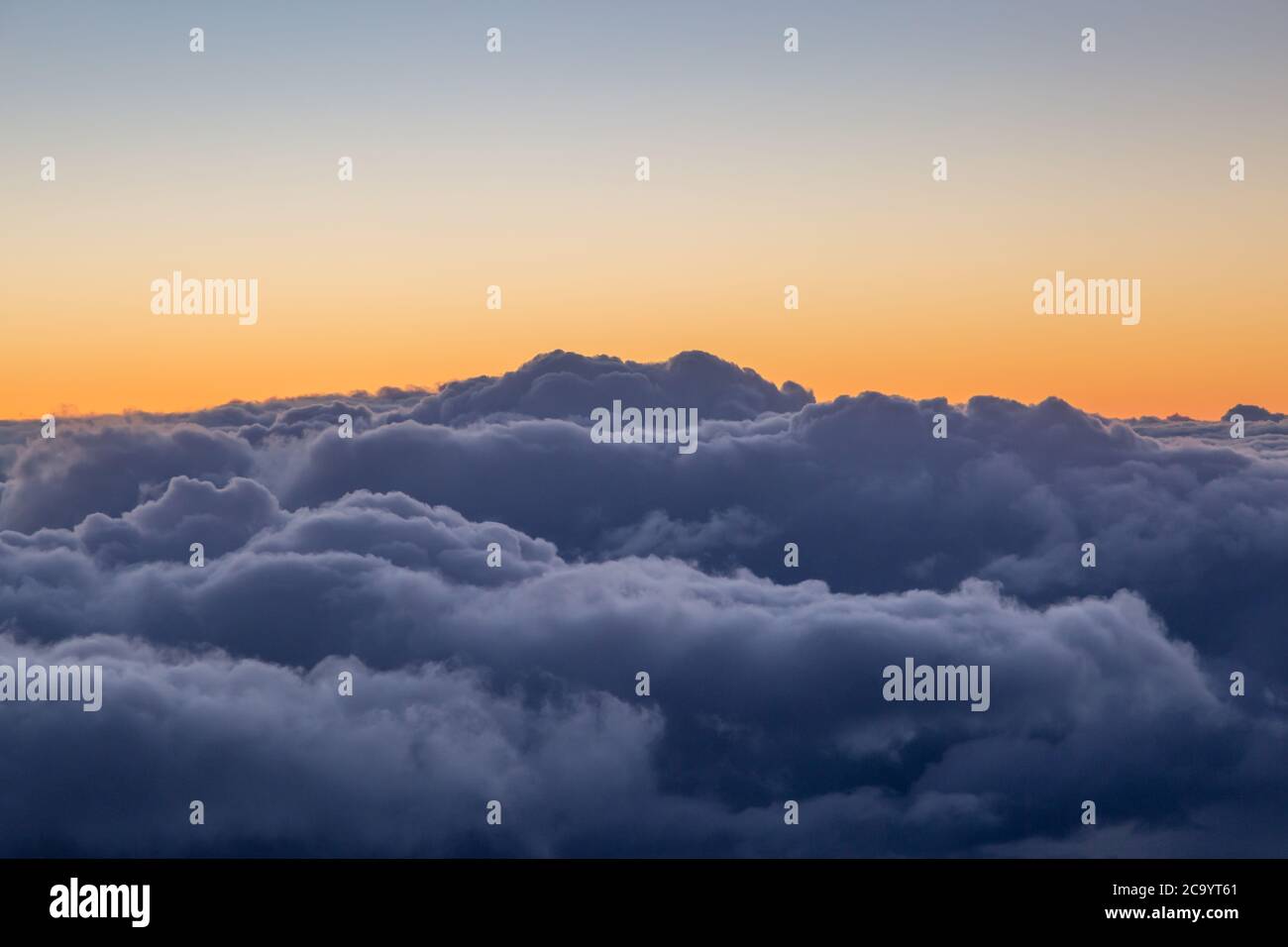 Dramatic Clouds and a Sunset Sky, Viewed from an Airplane Stock Photo