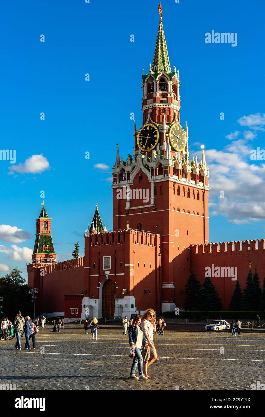 Moscow - July 23, 2020: Kremlin on Red Square in Moscow, Russia. Is is famous tourist attraction of Moscow, top Russian landmark. People walk next to Stock Photo